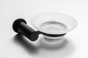 Black and white soap dish with holder for bathroom decor and accessories.