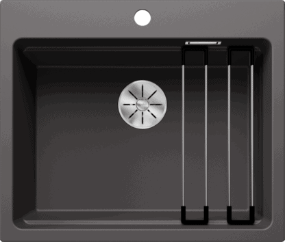 Stainless steel kitchen sink with drainer and tap holes for modern kitchen setup.