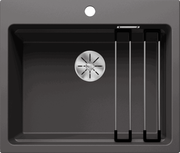 Stainless steel kitchen sink with drainer and tap holes for modern kitchen setup.