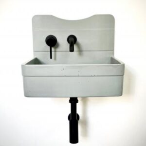 Vintage wall-mounted utility sink with backsplash, perfect for laundry rooms and workshops. Made from durable material, easy to install and maintain.