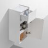 A white bathroom wall cabinet with open drawers and storage shelves holding toiletries and bottles. Suitable for bathroom organization and space-saving storage.