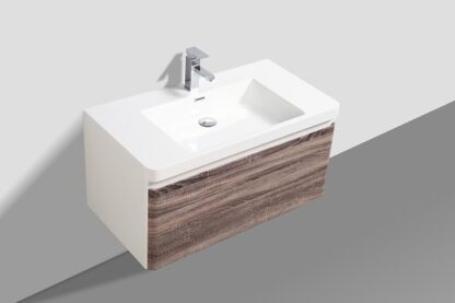 Modern wall-mounted bathroom vanity with a sleek white bowl and wood finish cabinet, ideal for contemporary bathroom designs and efficient space utilisation in South African homes.