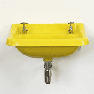 Bright yellow vintage bathroom sink with dual taps, modern bathroom fixture, colourful bathroom decor, stylish wash basin, bathroom renovation accessories.