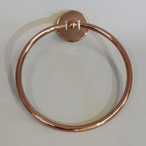 Elegant rose gold towel ring mounted on a bathroom wall, perfect for modern bathroom decor and organisation.