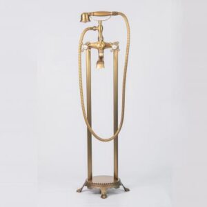 Vintage gold freestanding bathtub faucet with hand shower for luxury bathroom decor.