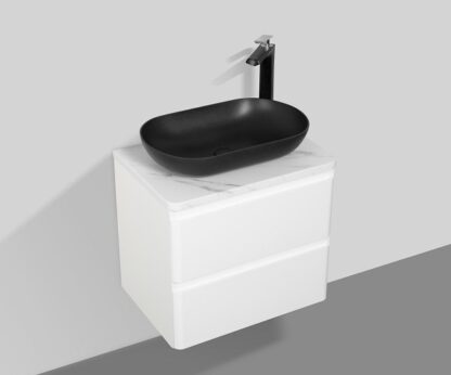 Solid black vessel sink with modern black faucet above white bathroom vanity cabinet. Perfect for contemporary bathroom decor and stylish washbasin setups.
