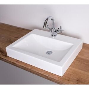 Vessel bathroom sink with chrome faucet on wooden countertop, modern bathroom fixture for stylish and functional washbasins.